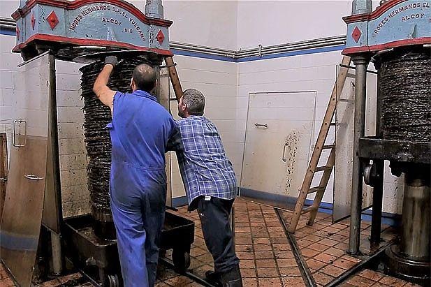 Ward mill workers operating the press